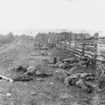 Confederate dead line the length of a fence on the Hagerstown road (September 1862, Alexander Gardner, photographer; Library of Congress)