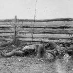Soldiers of Stonewall Jackson's brigade are piled against a rail fence on the Hagerstown pike (September 1862, Alexander Gardner, photographer; Library of Congress)