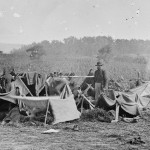 Dr. Anson Hurd, of the 14th Indiana Volunteers, attends to convalescing Confederate wounded troops in tents set up as a field hospital near Keedysville, Maryland (September 1862, Alexander Gardner, photographer; Library of Congress)
