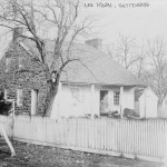 A woman stands in the doorway of the house used as General Lee's headquarters during the Battle of Gettysburg (c.1913, William H. Tipton, photographer; Library of Congress)