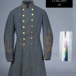 Confederate infantry officers gray frock coat with three gold stripes indicating the rank of Captain. Brass buttons are decorated with the Virginia state seal. (Gettysburg National Military Park)